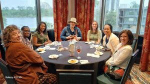 A group of people sitting around a table.