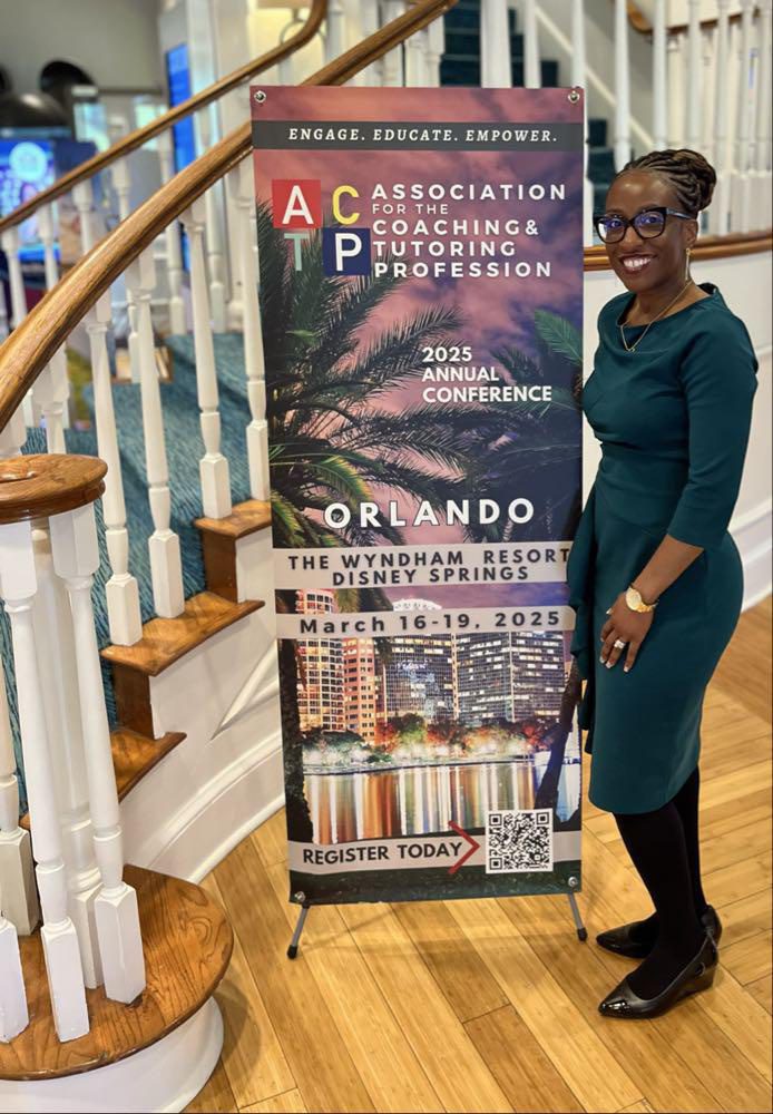 A woman standing next to a sign on the stairs.