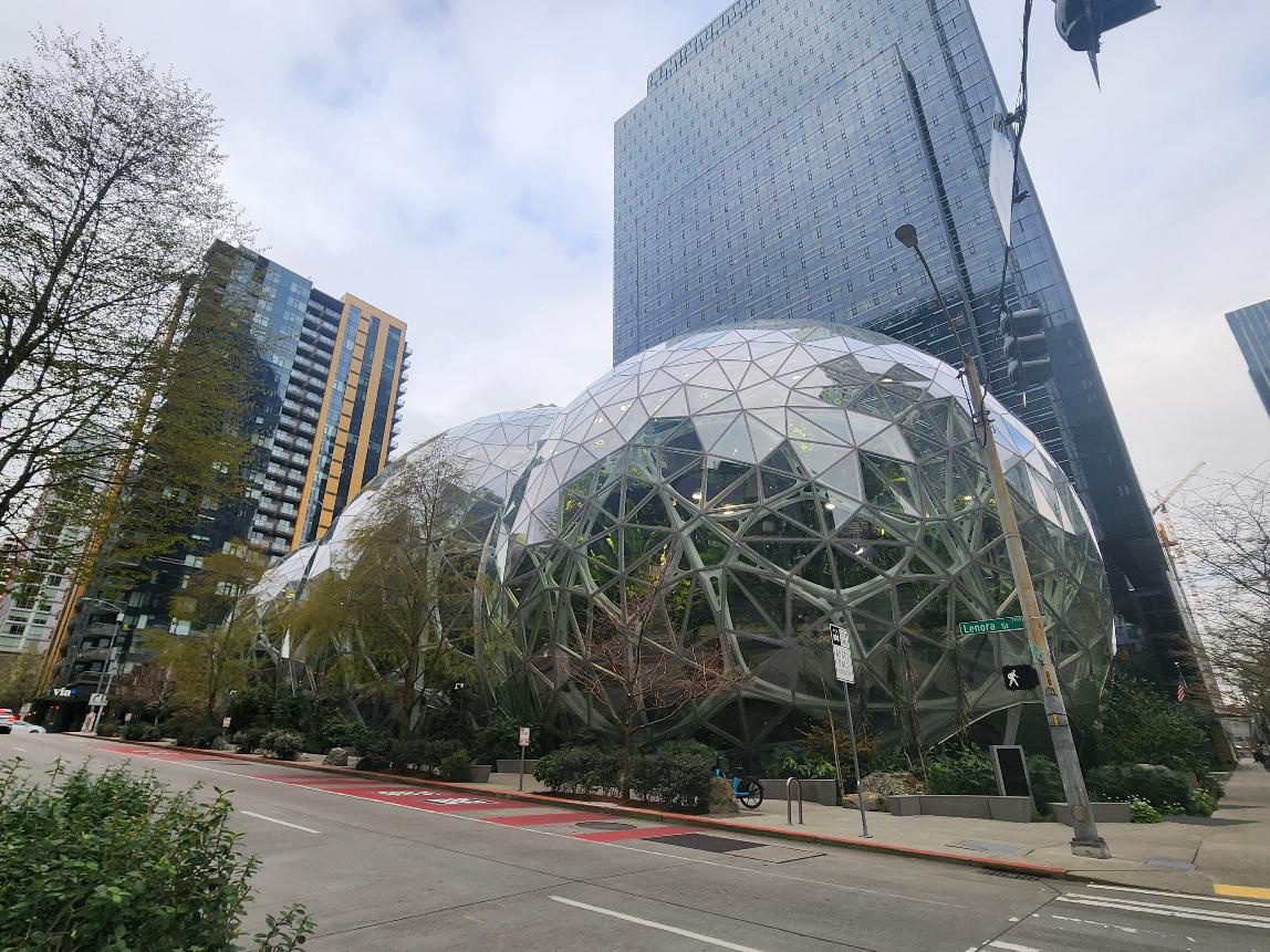 Glass domes surrounded by modern skyscrapers.