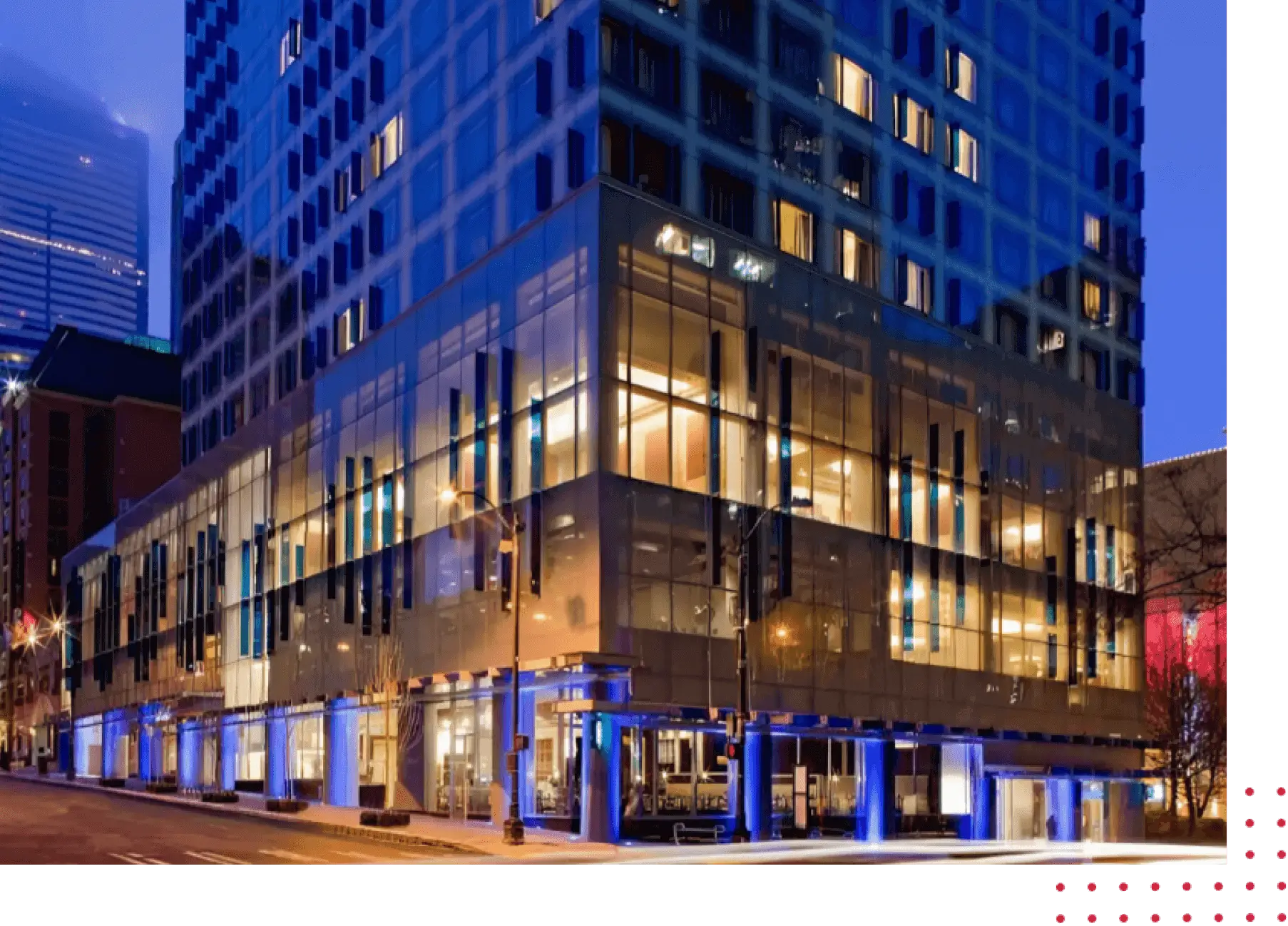 A building with many windows and lights on it